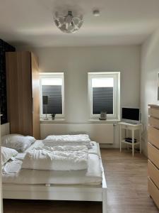 Ένα ή περισσότερα κρεβάτια σε δωμάτιο στο Altes Zollhaus Burgstaaken Fehmarn