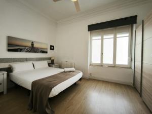 Postel nebo postele na pokoji v ubytování FLORIT FLATS - The Ausias March Apartment