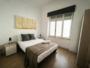 Postel nebo postele na pokoji v ubytování FLORIT FLATS - The Ausias March Apartment