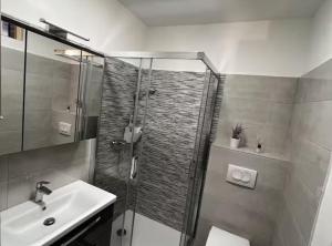 a bathroom with a shower and a sink at House Burić in Senj +26 photos