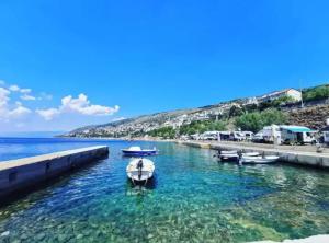 a group of boats in a body of water at House Burić in Senj