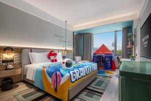Postel nebo postele na pokoji v ubytování EVEN Hotel Yining