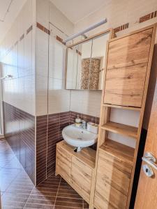 a bathroom with a sink and a shower at Sea View City Beach Apartment in Larnaka +37 photos