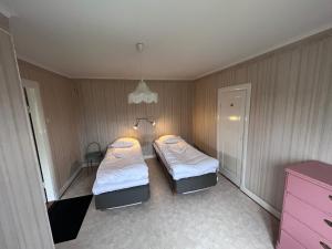 Postel nebo postele na pokoji v ubytování Aspa Herrgård - Handelshuset
