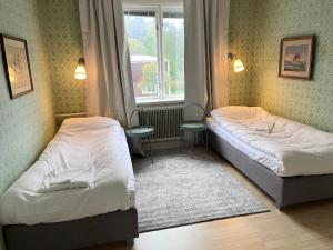 Postel nebo postele na pokoji v ubytování Aspa Herrgård - Handelshuset