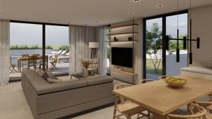 Linea Verde Villa Exclusive by Sealand Villas في تسيليفي: غرفة معيشة مع أريكة وطاولة