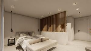 Linea Verde Villa Exclusive by Sealand Villas في تسيليفي: غرفة نوم بها سرير كبير وكرسي