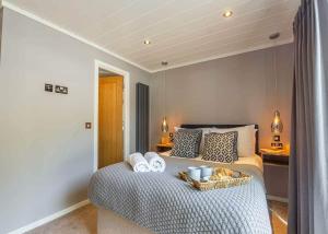 a bedroom with a bed with towels on it at SL14 - The Watchtower with Hot Tub in Bethesda