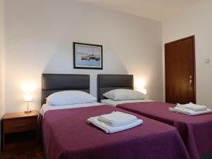 Postel nebo postele na pokoji v ubytování Apartments Valentina-B