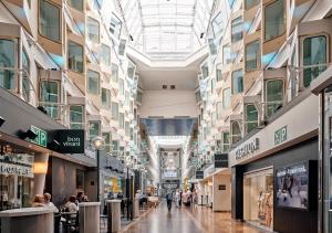 a shopping mall with people walking through it at Tallink Silja Line Ferry - Helsinki to Stockholm in Helsinki