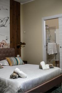 a bedroom with a bed with towels on it at Burgi's House in Pizzo +2 photos