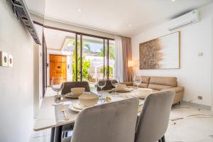 a dining room with a table and chairs at Frelin Villas - 1 BR, 2 BR Luxury Villa Complex in Kerobokan