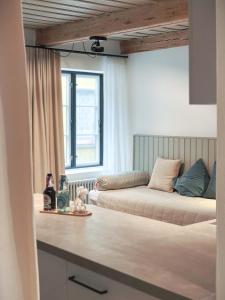 a living room with two beds and a couch at Ferienwohnung 2, Schlaf-Gut-Johannis, Flensburg in Flensburg