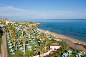 an aerial view of a beach with umbrellas and the ocean at Creta Star Hotel - Adults Only in Skaleta