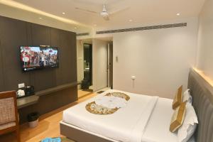 TV a/nebo společenská místnost v ubytování Simran Heritage(Business Hotel