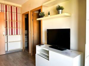 Televízia a/alebo spoločenská miestnosť v ubytovaní Apartamento super luminoso