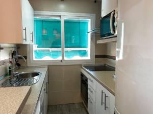 Kuchyňa alebo kuchynka v ubytovaní Apartamento super luminoso