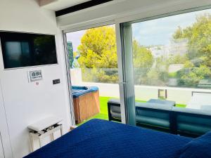 a bedroom with a bed and a large window at CHALET MÁGICO en Orihuela Costa in Los Dolses +93 photos