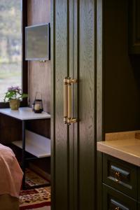 a door to a room with a desk and a desk at Villa Marusya Qusar in Qusar