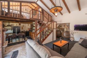a living room with a couch and a table at Krka home in Bogatić