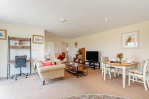 a living room with a couch and a table at 1 Bed in Flore oc-b32437 in Flore