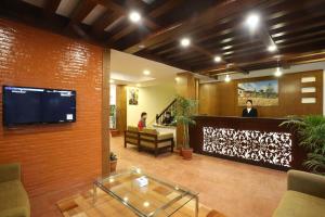 TV i/ili multimedijalni sistem u objektu Hotel Jay Suites