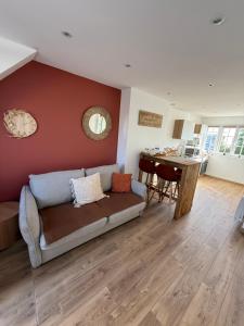 a living room with a couch and a table at Côté canche in Étaples