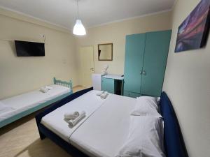 Postel nebo postele na pokoji v ubytování OKEJ Hotel