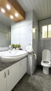 a bathroom with a sink and a toilet at Modern 3BDR_Top Floor_Lux_Suite_Balcony in Limassol