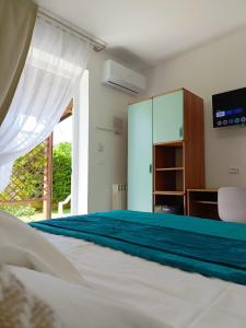 Postel nebo postele na pokoji v ubytování Albergo ristorante Elena
