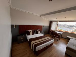 A bed or beds in a room at Blue Istanbul Hotel Taksim