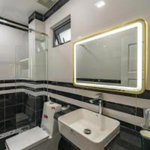 a bathroom with a sink and a mirror at Belvilla Near Tan Son Nhat International Airport - Formerly Vyvy Hotel in Ho Chi Minh City