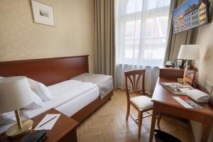 Postel nebo postele na pokoji v ubytování Hotel Rott