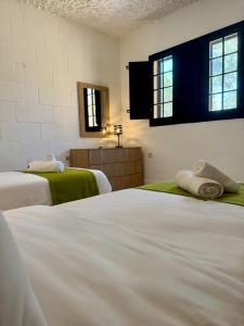Voodi või voodid majutusasutuse Cornucopia Hotel toas +37 fotot