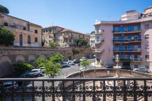 a view of a city with cars parked in a parking lot at Best Western Plus Fontana Falconieri Hotel in Messina