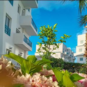 a view of a building with plants in front of it at Marina Puerto Luxurious apartment in Tetouan