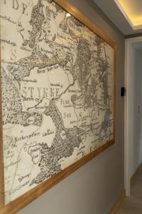 a map hanging on a wall at DK Housing in Mendoza