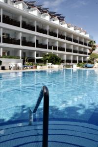 a large swimming pool in front of a building at Estudio con Piscina en Puerto de la Cruz in Puerto de la Cruz +3 photos