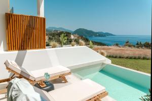 a view of the ocean from the balcony of a house at Orizontas Suites in Syvota