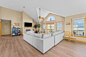 a living room with a couch and a table at By the See in Waves +50 photos