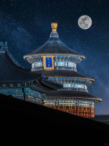 a large building at night with a moon in the sky at East Sacred Hotel-Very close to the Drum Tower,The Lama Temple,Houhai Bar Street,Nanluoguxiang,Tiananmen Square and the Forbidden City, and the subway st ation is also very close in Beijing