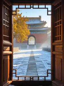 a view through an open door at East Sacred Hotel-Very close to the Drum Tower,The Lama Temple,Houhai Bar Street,Nanluoguxiang,Tiananmen Square and the Forbidden City, and the subway st ation is also very close in Beijing