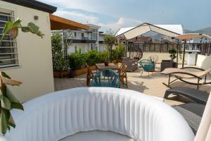 a patio with chairs and tables on a balcony at B&B Da Giovanni in Casapulla