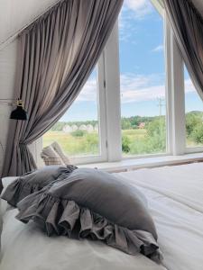 Łóżko lub łóżka w pokoju w obiekcie Apartamenty Pogodna