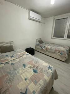 Katil atau katil-katil dalam bilik di Marie apartments