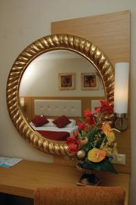 A bed or beds in a room at Alaiye Resort & Spa Hotel - Ultra All Inclusive