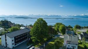an aerial view of a building and the water at Moldefjord Hostel in Molde