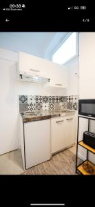 Η κουζίνα ή μικρή κουζίνα στο Appartement Acote de paris ou Disney