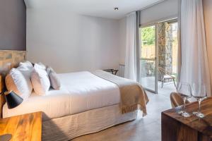 Cama ou camas em um quarto em Lares De Chacras