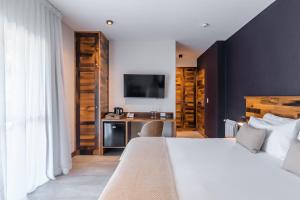 Cama ou camas em um quarto em Lares De Chacras